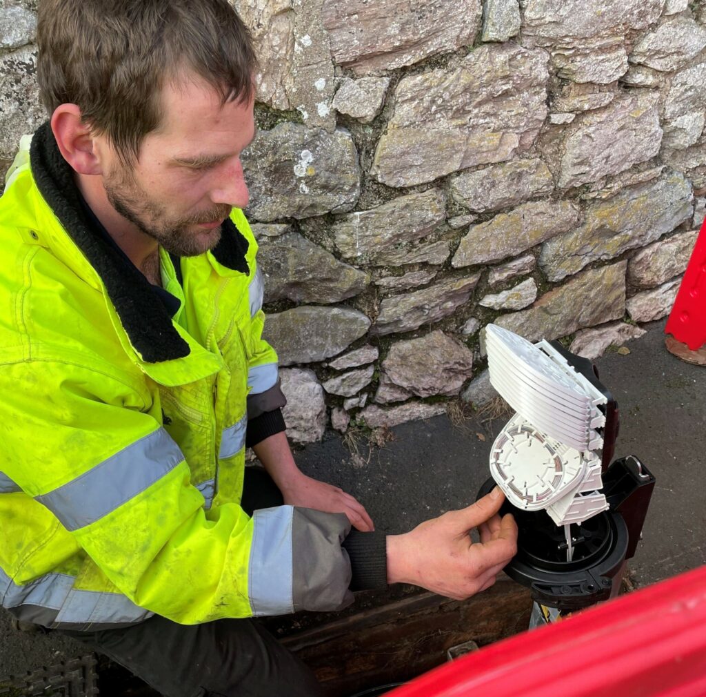 Engineer working on fibre cabling